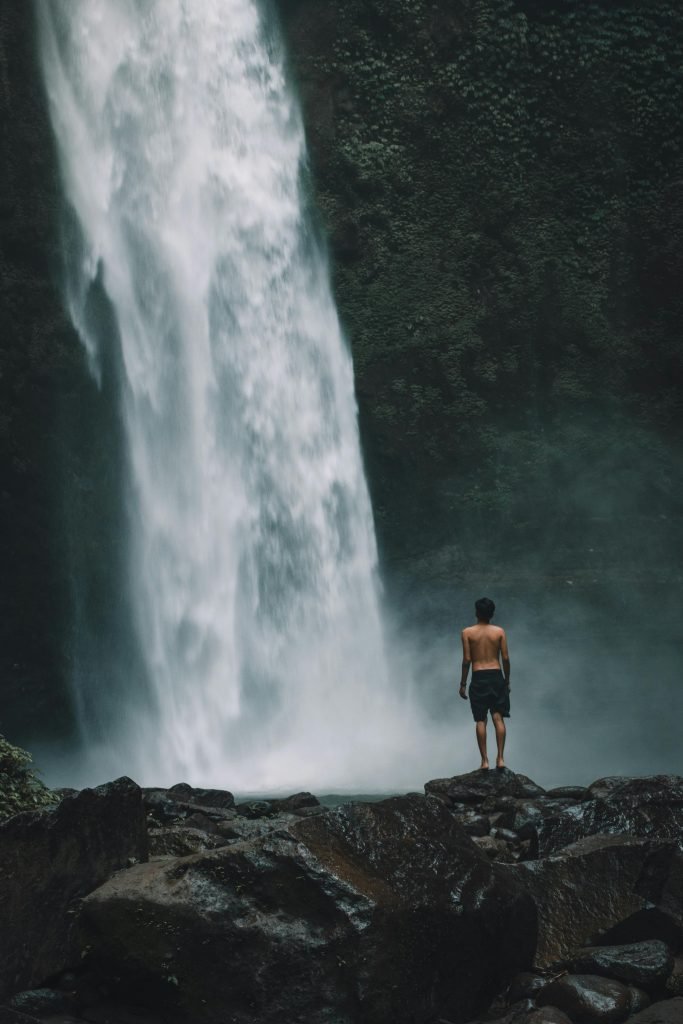 Gitgit Waterfall surrounded by lush greenery in Bali, Indonesia