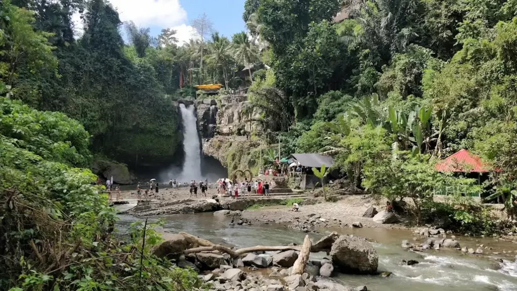 A captivating view of Tegenungan Waterfall in Bali, surrounded by lush greenery.